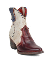 Introducing the Baila II by Bed|Stü: a women's ankle boot featuring Western-inspired design with a pointed toe, stacked heel, cream upper, burgundy leather overlay, blue stitch accents, and a side pull tab—expertly crafted to deliver the perfect blend of style and artisanal construction.