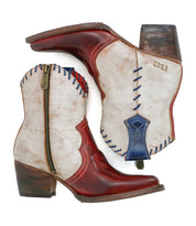 Introducing the Baila II ankle boots by Bed|Stü—these Western-inspired boots showcase artisanal craftsmanship with striking red pointed toes, crisp white uppers, blue stitched accents, brown heels, convenient side zippers, and intricate decorative stitching details.