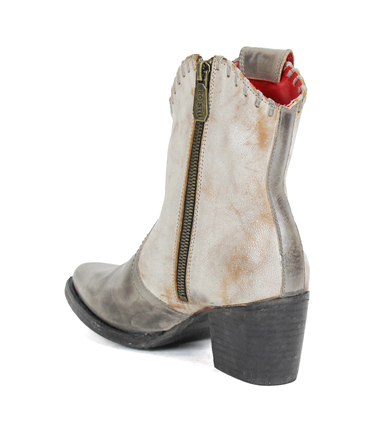 Sure! Here’s the revised sentence using the provided product data: The Bed|Stü Baila II is a distressed gray ankle boot with a chunky black heel, pointed toe, side zipper, and red inner lining. This Western-inspired style features signature detailing and is shown from the back and side views.