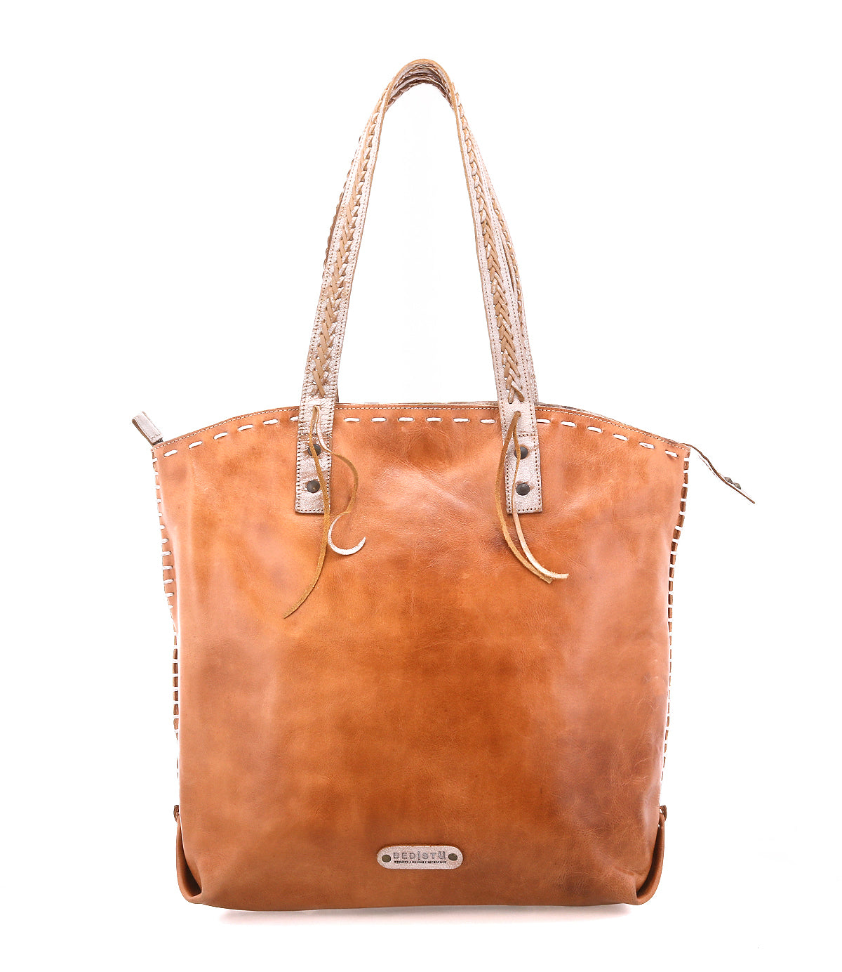 The Barra II by Bed|Stü is a brown leather handcrafted tote bag featuring intricate stitching, two braided handles, and a metal brand tag on the front. This elegant woven tote is shown against a plain white background.