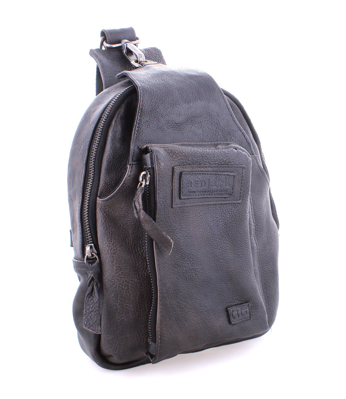 Introducing the Beau by Bed|Stü—a compact black leather backpack featuring a front zippered pocket and a top handle, displayed at a slight angle against a white background.