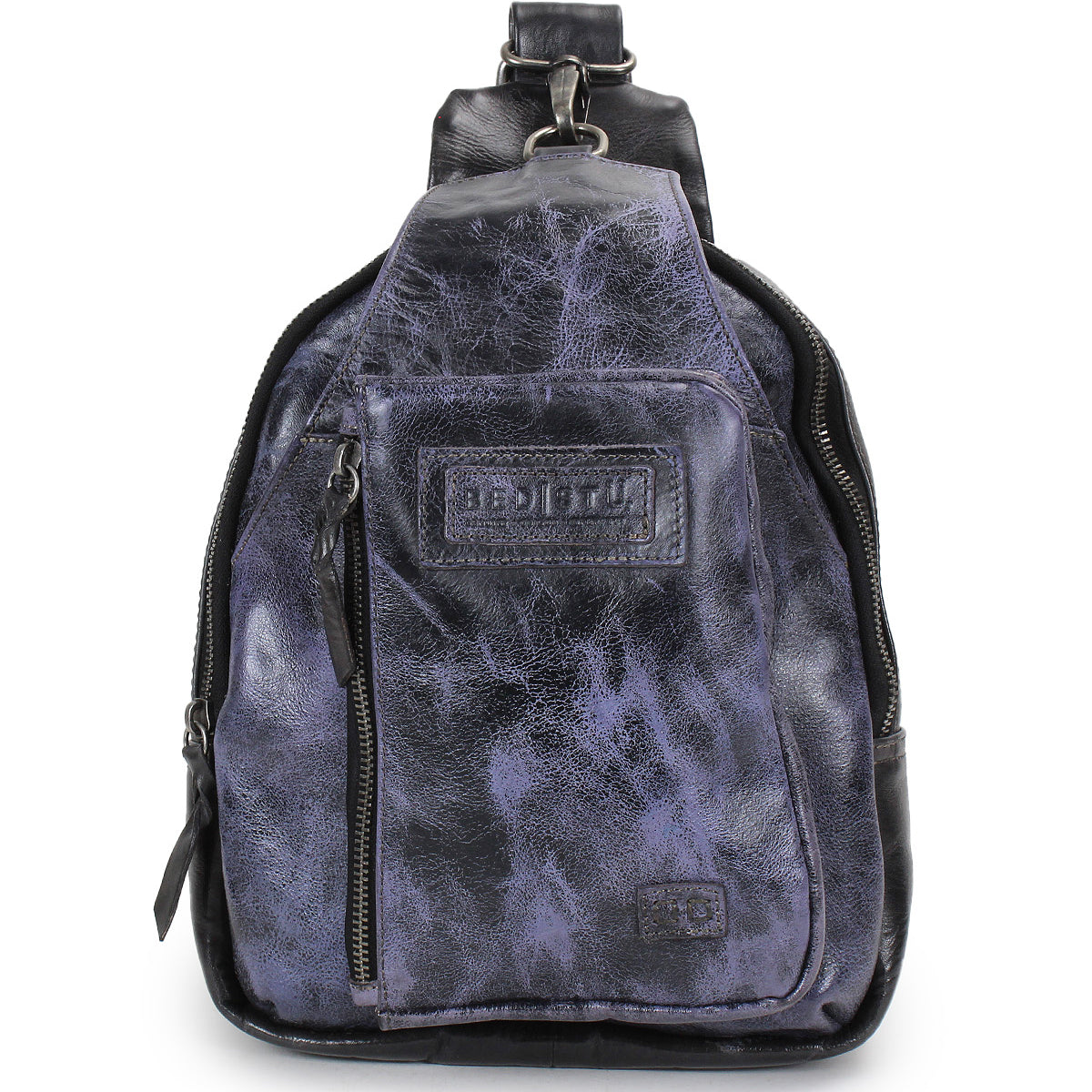 A small Beau sling backpack by Bed|Stü in dark purple and black leather, featuring a front zipper pocket and a stitched Bed|Stü brand label on the front.