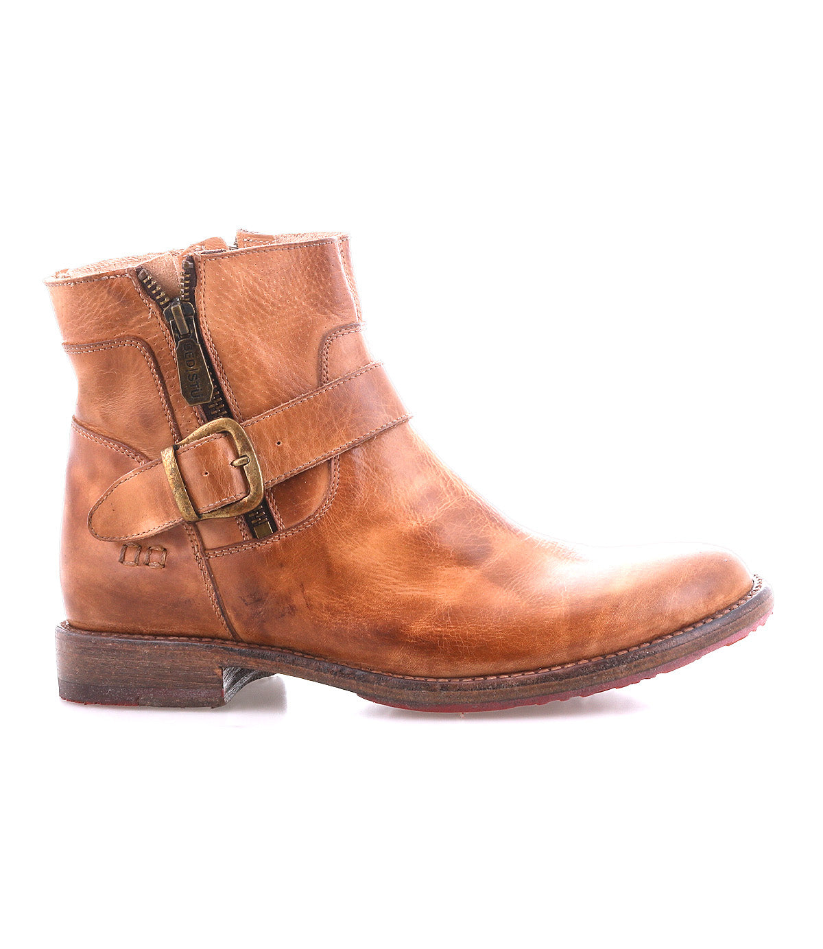 The Becca by Bed|Stü is a brown leather ankle boot with an ankle buckle, side zipper, and low heel. Featuring a sturdy leather shaft reminiscent of a classic engineer boot, it is shown in profile against a white background.
