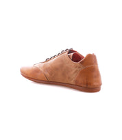 The Bed|Stü Bingo II, a brown leather lace-up shoe with Goodyear construction, is displayed at an angle from the back and side against a white background.