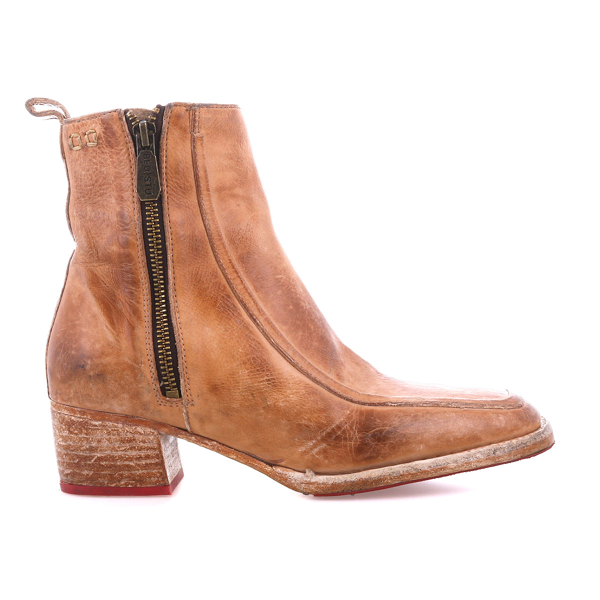 The Bed|Stü Bitsy boot is a light brown leather ankle boot featuring a side zipper, stacked heel, and a slightly worn finish.