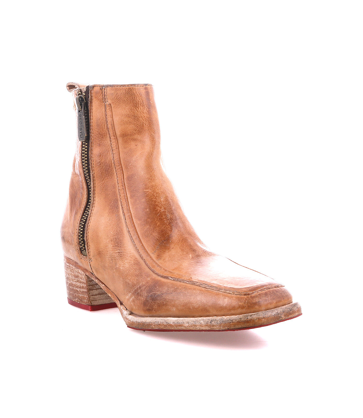 The Bed|Stü Bitsy is a brown leather ankle boot featuring a square toe, side zipper, low stacked heel, and a worn sole, shown against a white background.