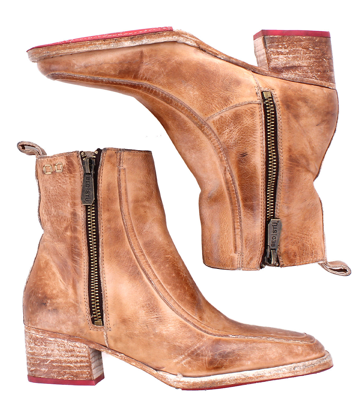 The Bed|Stü Bitsy boots are brown leather ankle boots featuring side zippers, a stacked heel, and distressed detailing on the heels and toes.