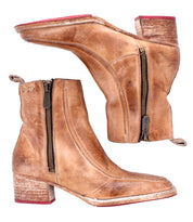 The Bed|Stü Bitsy boots are brown leather ankle boots featuring side zippers, a stacked heel, and distressed detailing on the heels and toes.