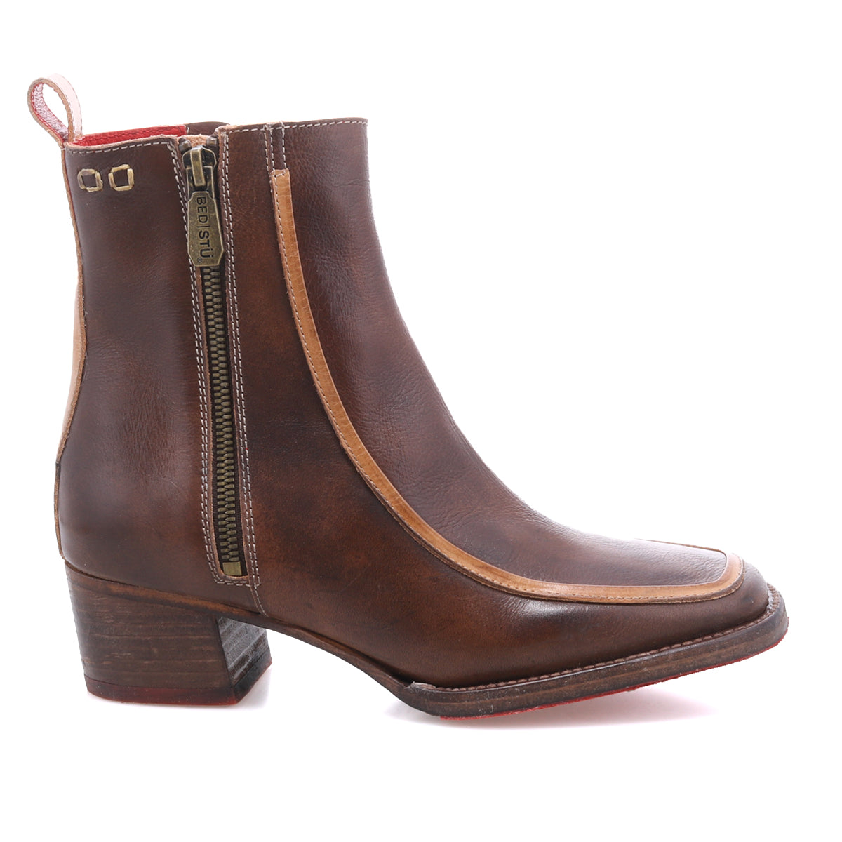 The Bed|Stü Bitsy is a brown leather ankle boot featuring a side zipper, stacked heel, and tan trim, shown against a white background.