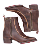 The Bitsy boots by Bed|Stü are brown leather ankle boots featuring side zippers, stacked heels, eye-catching red soles, and a chic square-toe design. Shown from the side and bottom views on a white background.