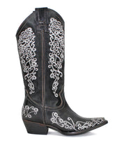 A single Bed|Stü Blackjack Western tall boot in black, featuring ornate white floral embroidery, a snip toe, and a stacked heel, displayed on a white background.