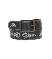 Blaze JB by Bed|Stü is a black full-grain leather belt featuring an antique-finished silver buckle and detailed white embroidered scrollwork patterns along its length.