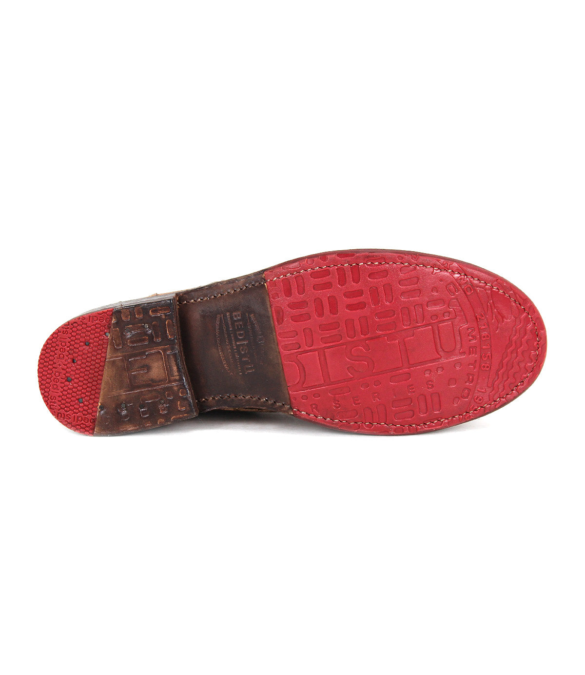 The image shows the red sole of the Bed|Stü Bonnie II dress shoe with a Goodyear-welted outsole, featuring a textured pattern with letters and a brown heel section attached.