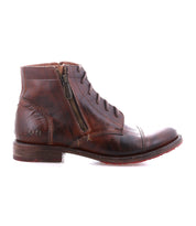 The Bed|Stü Bonnie II is a brown leather combat ankle boot featuring a cap toe, visible stitching, side zipper, laces, and a worn Goodyear-welted outsole, displayed in a left-side profile view on a white background.