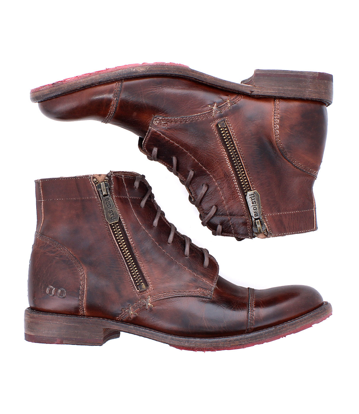 The Bed|Stü Bonnie II boots are a pair of brown leather combat ankle boots featuring a cap toe design, lace-up fronts, side zippers, Goodyear-welted outsoles, and worn detailing, shown from the side on a white background.