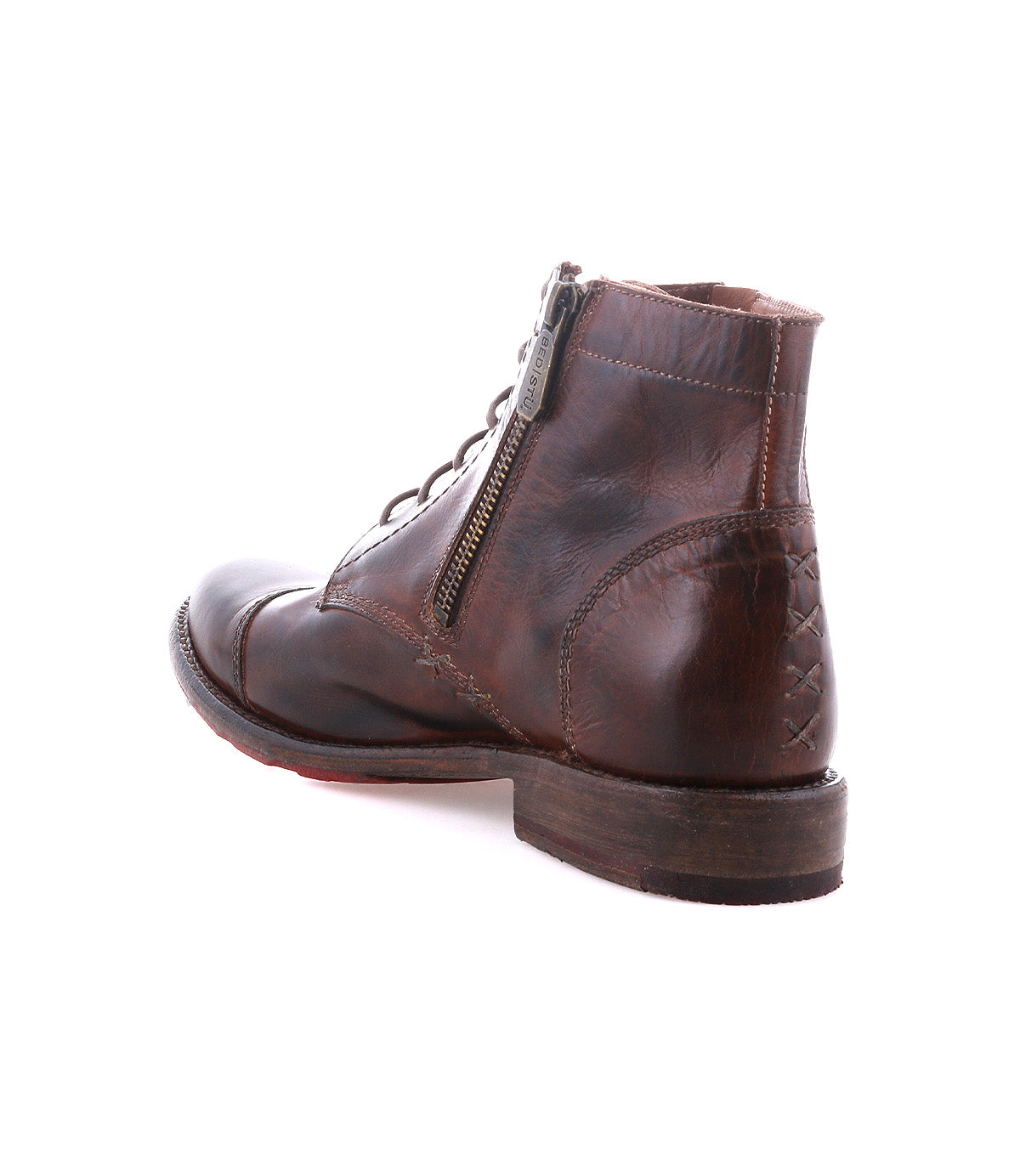 The Bed|Stü Bonnie II is a brown leather combat ankle boot with a cap toe and lace-up design, featuring a side zipper and distressed detailing at the toe and heel, shown at an angle against a white background.