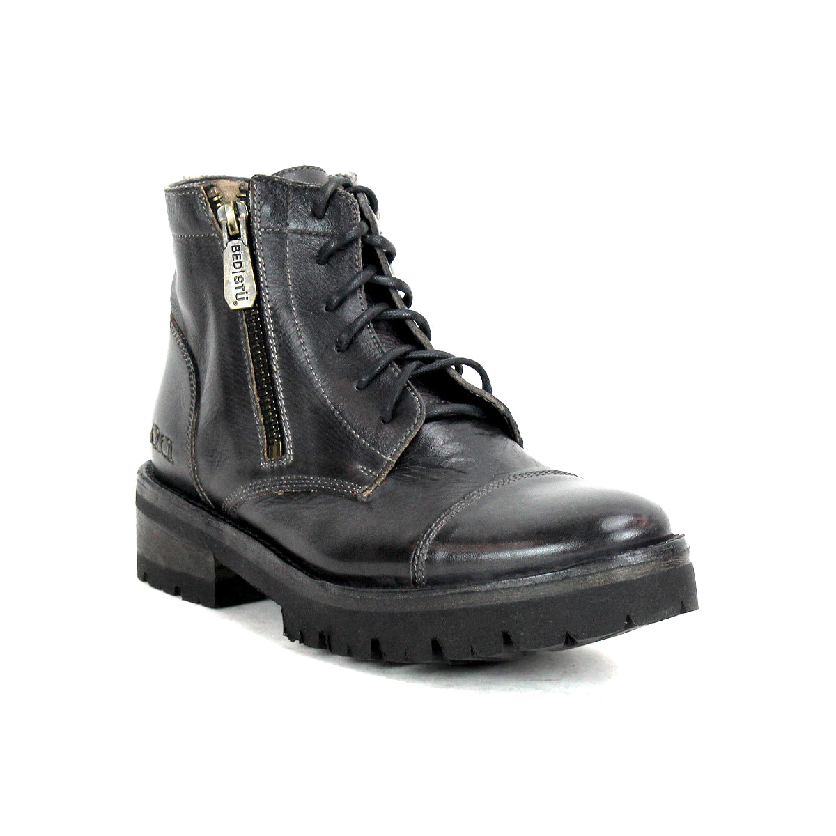 The Bed|Stü Bonnie IV is a black leather combat boot, featuring a secure fit, lace-up design, rugged sole, and convenient side zipper, shown on a white background.