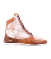 Introducing Breath by Bed|Stü—a high-top, multi-tone leather sneaker featuring rich brown and metallic silver panels, a lace-up front, crisp white sole, and eye-catching metal studs near the heel. Ideal for anyone looking to make a statement with sneakers that channel a retro court-inspired vibe.