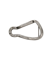 The Bed|Stü Biner Buckle is a worn metal carabiner with a spring-loaded gate and an antiqued silver finish, shown isolated on a white background.