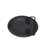 The Brit Oval Buckle by Bed|Stü is shown from the back, highlighting its oval-shaped black metal form with a bar and clasp mechanism and a subtly textured finish, set against a plain white background.