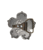 Back view of the Bed|Stü Flower Sparkle Buckle, featuring a scalloped edge, visible screws, and a metal loop for belt attachment.
