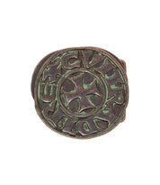 Bed|Stü's Greek Cross Buckle showcases a central Greek cross design inspired by ancient coins, with a circular inscription in stylized script and an authentic oxidized bronze-green patina for a distinctive vintage finish.