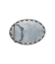 Back view of the Bed|Stü Tube Buckle, an oval metal leather belt buckle featuring visible stitching and a hinged clasp mechanism on the left side—ideal for adding a subtle coastal touch to any outfit.