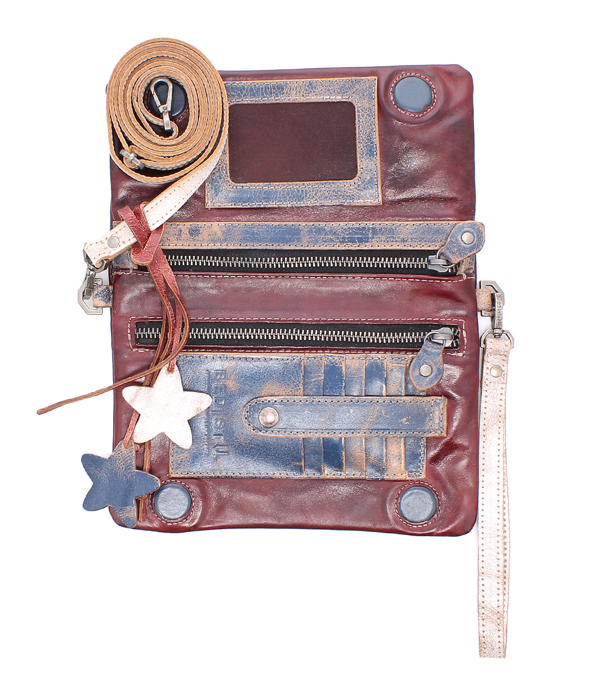 The Cadence by Bed|Stü is a distressed 3-in-1 leather wallet crafted from vegetable-tanned leather, designed with zippers, card slots, star-shaped keychains, a long strap for crossbody clutch styling, and a convenient wristlet—displayed on a white background.