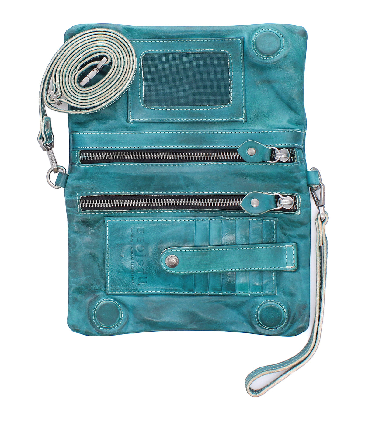 The Cadence by Bed|Stü is a teal, vegetable-tanned leather crossbody bag featuring two zippered compartments, card slots, a clear ID window, and an adjustable strap. Shown open and empty, this versatile clutch combines style and function.