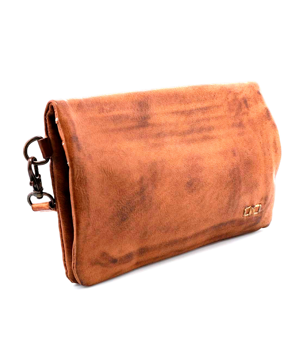 The Cadence clutch by Bed|Stü, crafted from brown vegetable-tanned leather and finished with a metal clasp, is shown against a white background.