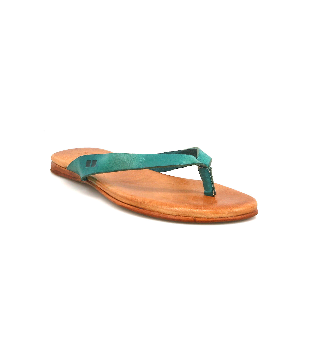 The Bed|Stü Calma is a comfortable, lightweight sandal in brown with a flat sole and a green fabric thong strap, shown on a white background.