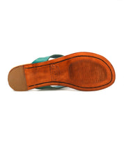 The underside of the Calma shoe by Bed|Stü—a single, comfortable leather design with a green upper—features a textured brown sole and heel with visible branding, expertly crafted to be both stylish and lightweight.