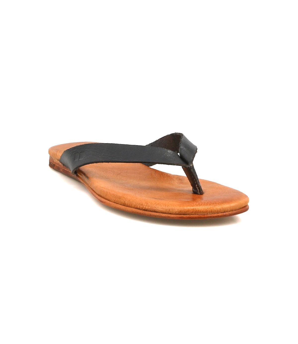 The Bed|Stü Calma is a comfortable, lightweight leather sandal with a brown flat sole and a black leather thong strap, shown from the front at a slight angle against a white background.