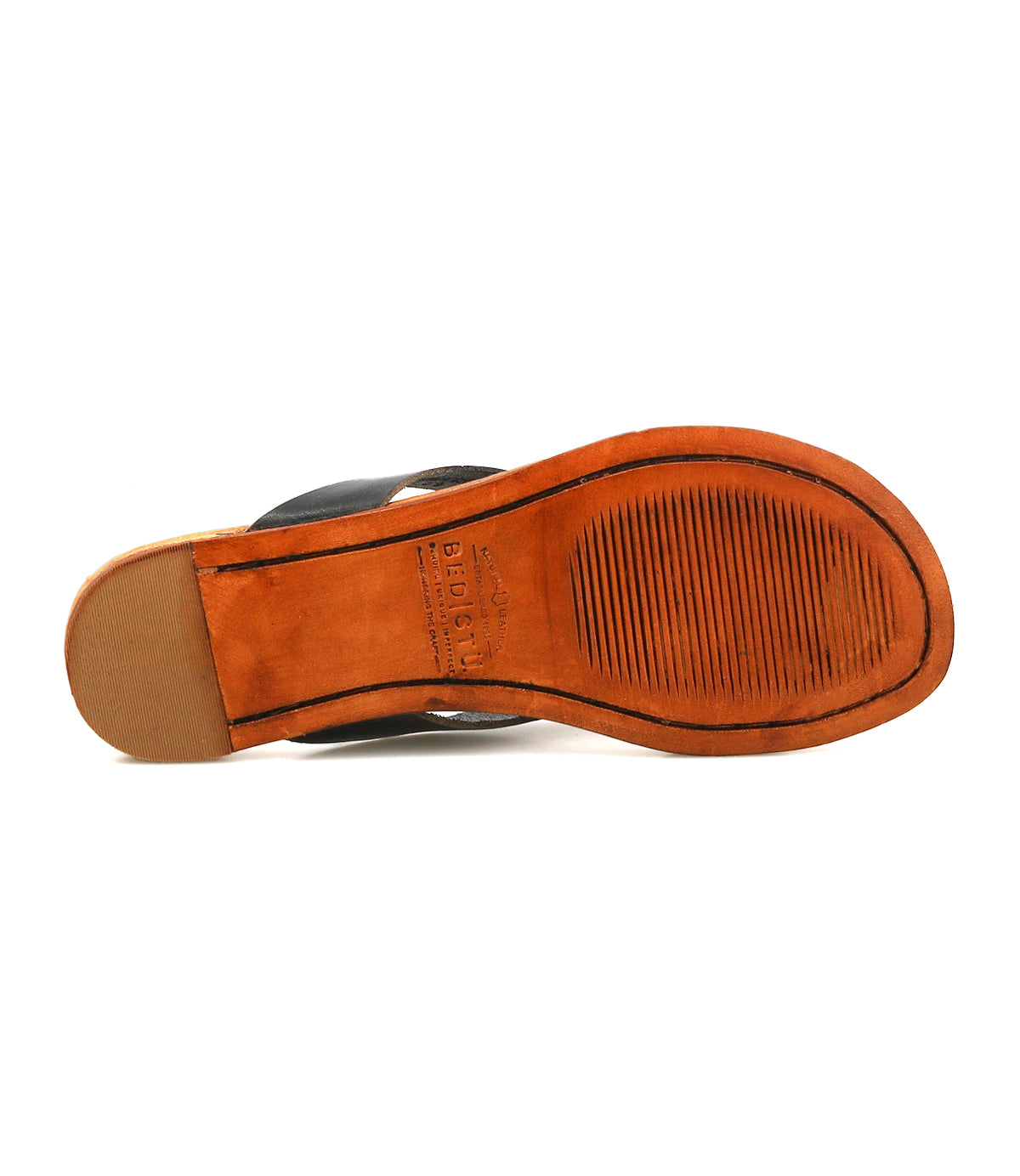 The image displays the underside of the Bed|Stü Calma leather dress shoe, featuring a tan sole with a ribbed rubber section under the ball of the foot, emphasizing its comfortable and lightweight design.