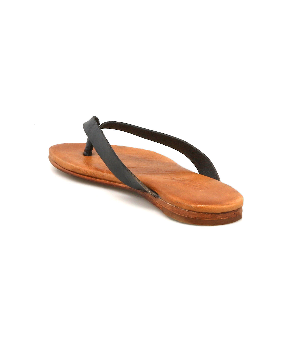 The Bed|Stü Calma sandal, featuring a flat sole and thin black straps, is displayed in brown leather on a white background and viewed from a rear diagonal angle.
