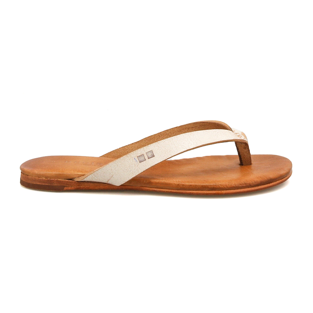 The Calma sandal by Bed|Stü is featured in a side view against a white background, showcasing its lightweight and comfortable design with a brown leather flip-flop base, a thin off-white strap, and a flat sole.