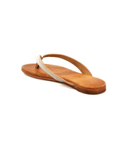 A single Bed|Stü Calma sandal in tan leather, featuring a thin light-colored strap and designed for a lightweight, comfortable fit, is photographed against a white background.