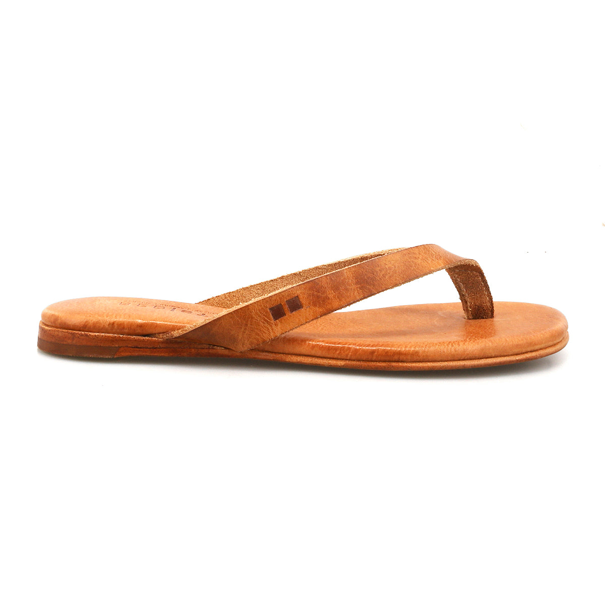 The Bed|Stü Calma is a lightweight brown leather sandal featuring a flat sole and simple strap, pictured in a side view against a white background and designed for comfortable everyday wear.