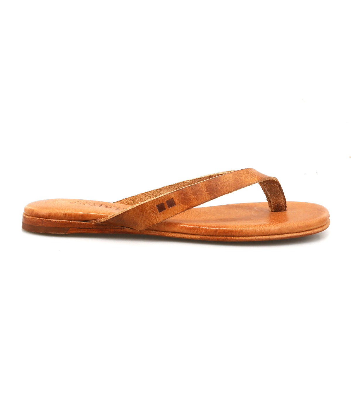 The Bed|Stü Calma is a lightweight brown leather sandal featuring a flat sole and simple strap, pictured in a side view against a white background and designed for comfortable everyday wear.