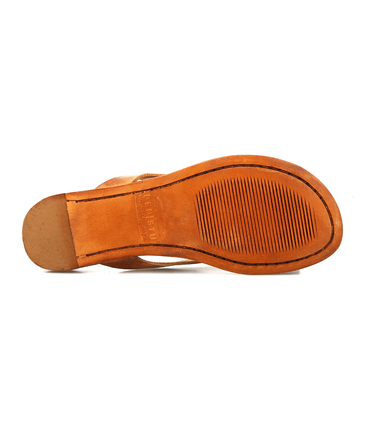 The image features the Calma shoe by Bed|Stü, showcasing the bottom view of its brown leather design with a textured rubber sole and small stacked heel, emphasizing its lightweight construction for exceptional comfort.