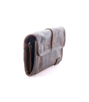 The Bed|Stü Canton is a dark brown 2-in-1 leather wallet with a distressed finish, displayed against a white background.
