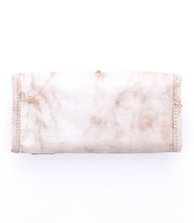 The Bed|Stü Canton 2-in-1 clutch, featuring light-colored worn leather with visible stains and signs of use, is displayed against a white background.