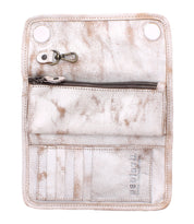 The Bed|Stü Canton wallet, crafted from light-colored, worn leather, is open to reveal its compact size with a zippered pocket, metal key clip, card slots, and two snap buttons.