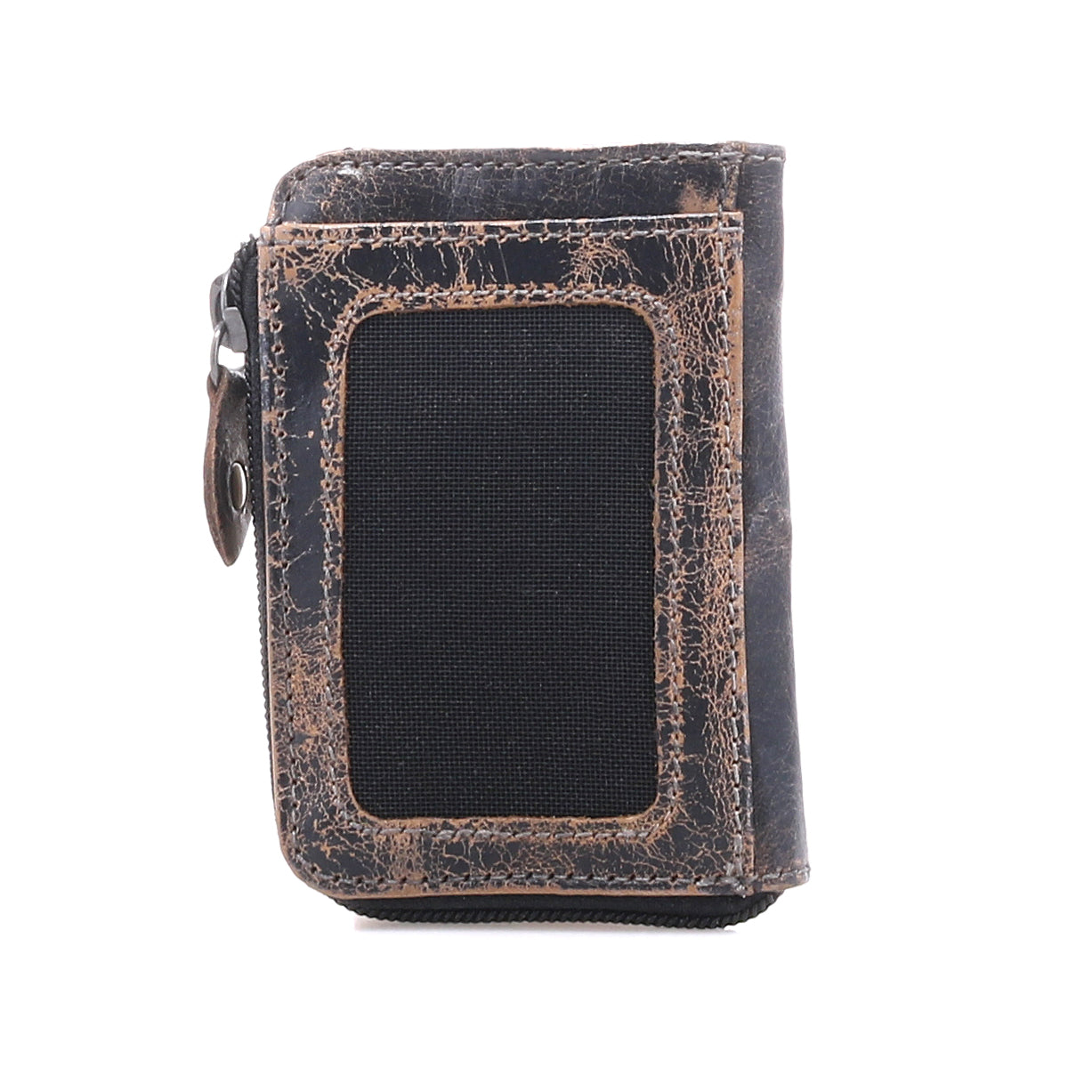 Introducing the Carrie by Bed|Stü—a compact brown leather wallet characterized by its gently worn finish and a distinctive black rectangular patch on the front. Designed for practicality, it features a convenient side zip compartment for secure storage and multiple card slots, all showcased against a crisp white background.