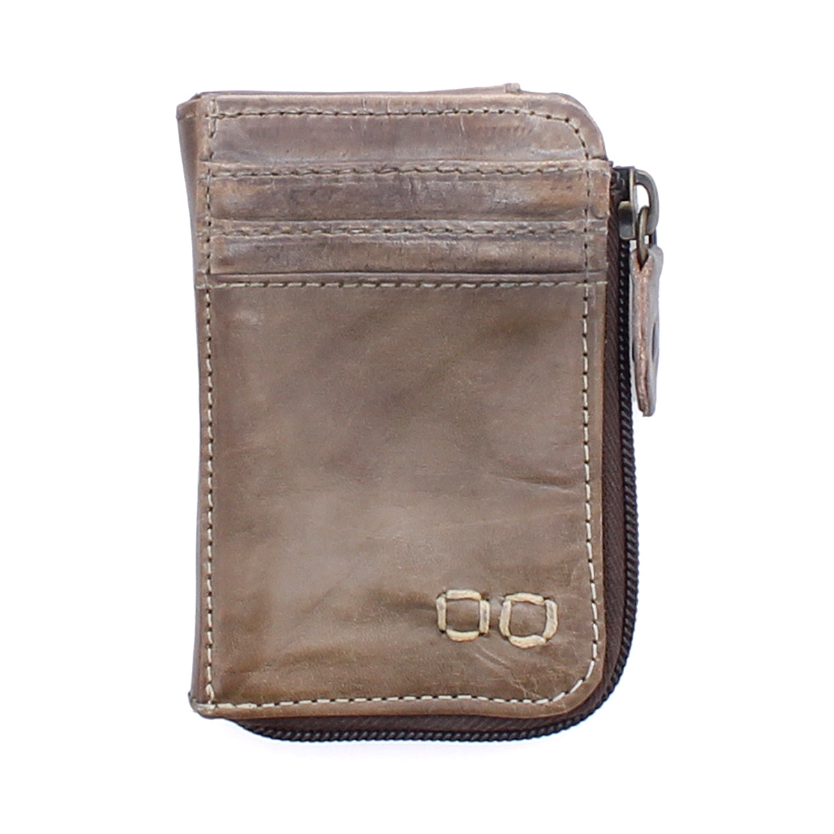 The Carrie by Bed|Stü is a compact brown leather wallet featuring visible stitching, easy-access card slots, and a zippered edge, photographed against a white background.