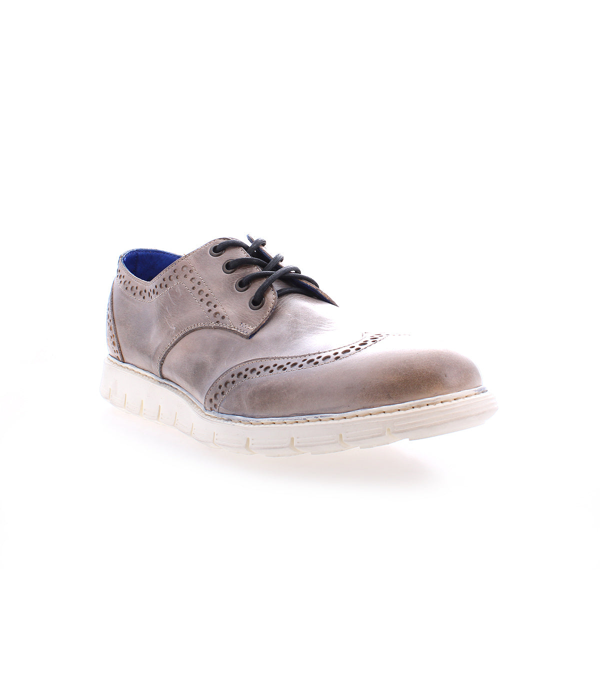 The Bed|Stü Cayuga II is a single brown leather derby shoe with brogue detailing, including a white sole, black laces, decorative perforations inspired by classic wingtip designs, and a blue inner lining, showcased against a white background.