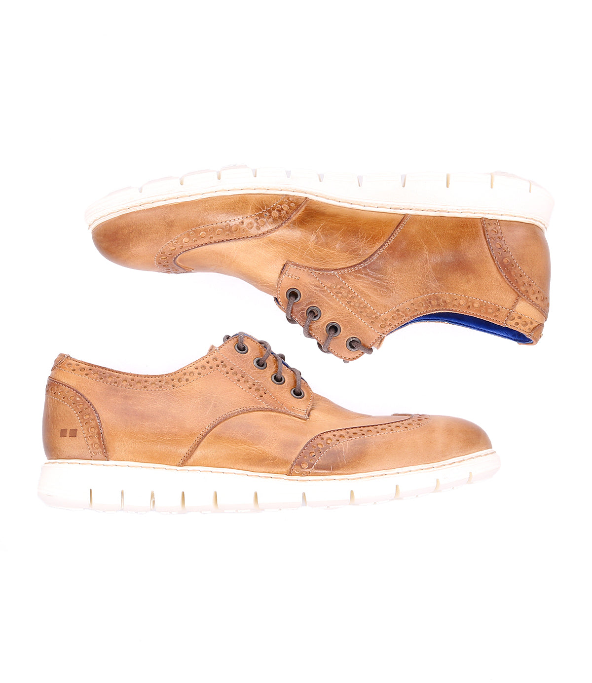 A pair of Bed|Stü Cayuga II light brown leather derby shoes with brogue detailing and white soles, shown from the side on a white background.