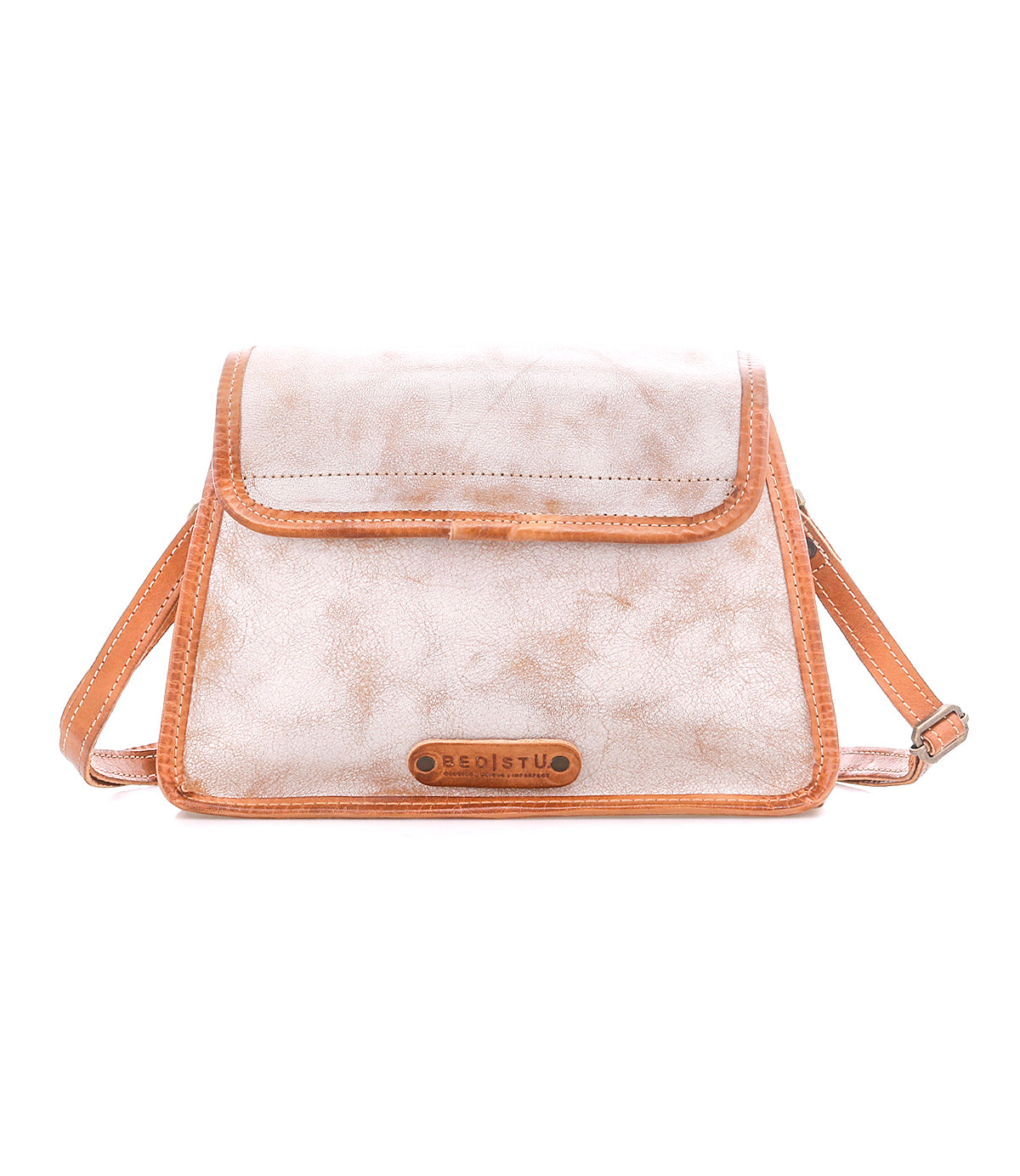 Introducing the Ceremonious by Bed|Stü—a small, rectangular preppy flap-top bag in beige with sophisticated tan trim. Designed with an adjustable strap and a front flap adorned with a brown Bed|Stü label, this accessory blends style and practicality. Its organized interior keeps your essentials neatly arranged, while the magnetic closure offers easy access on the go.