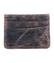 The Chuck by Bed|Stü is a compact card wallet crafted from brown, distressed leather, featuring two card slots on one side with visible wear and creases—ideal for everyday carry.