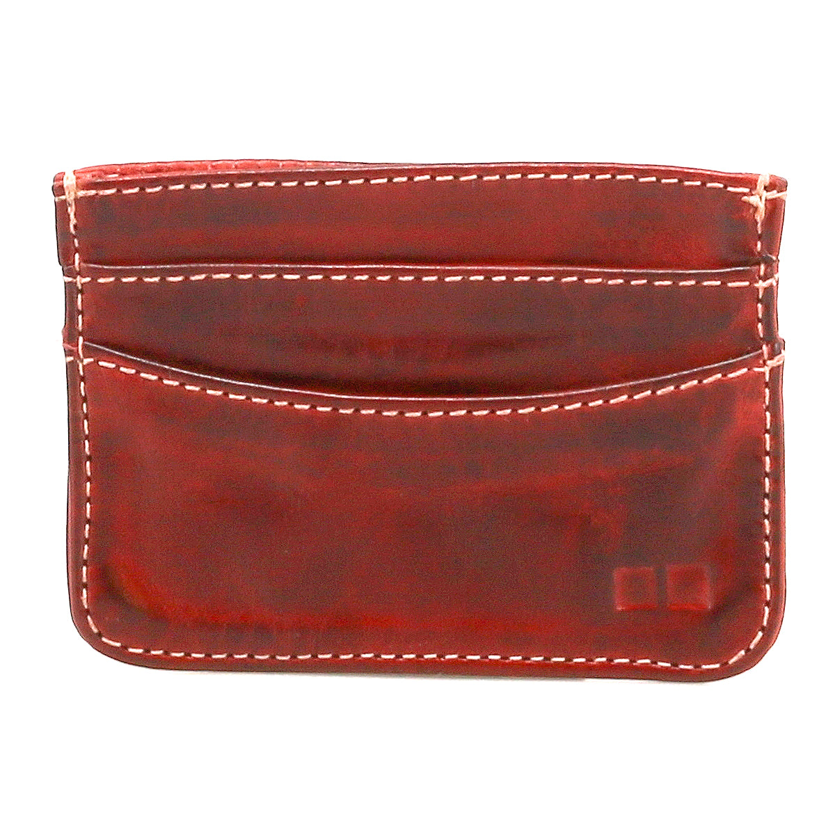 Introducing Chuck by Bed|Stü: this compact brown leather card holder, accented with white stitching, features two practical card slots and a distinctive curved top edge—perfect for everyday carry. Shown here against a white background.